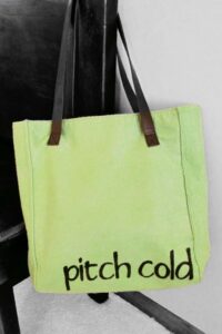 pitch cold stenciled on a green bag with freezer paper.