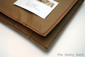 corner of sewn brown paper package.
