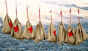 bags with a red cross on them.