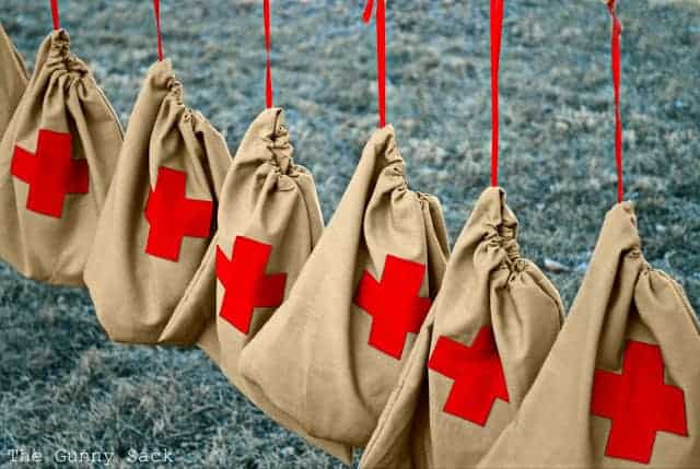 drawstring bags with red cross on them