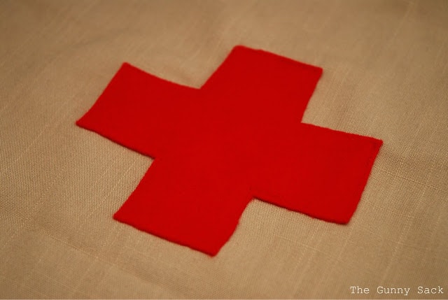 red cross sewn on fabric