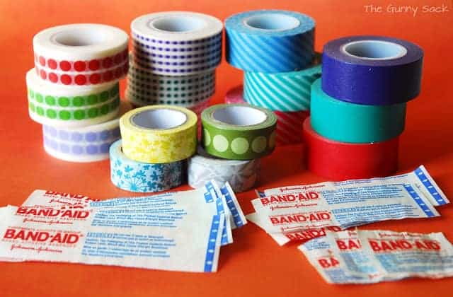 rolls of washi tape and bandages on a counter top.