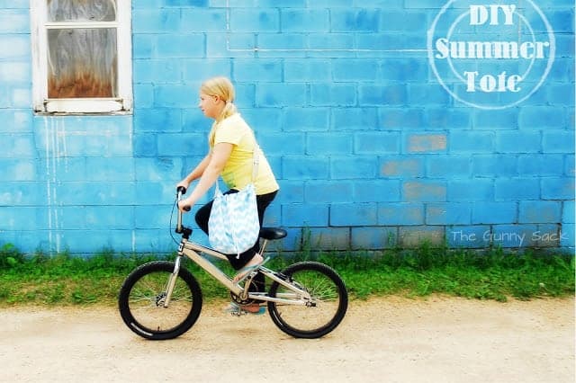 a girl riding a bike.