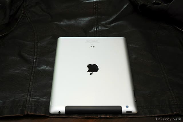 An iPad digital tablet on a cut sheet of leather.