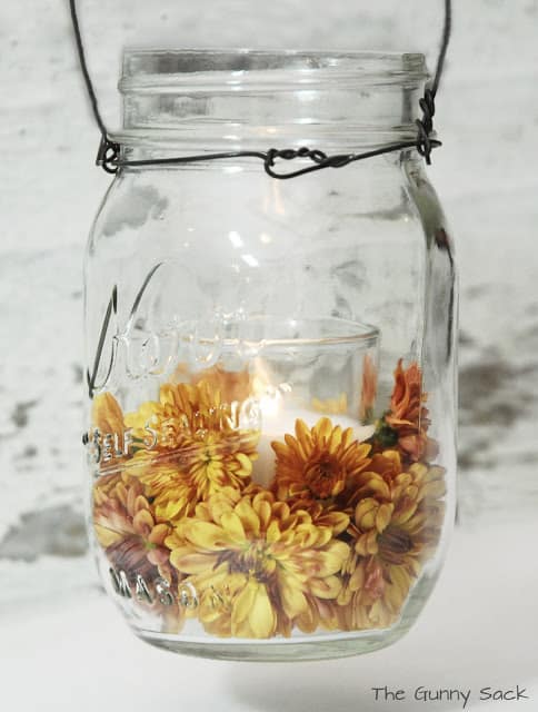 mason jar with mums and candle