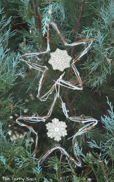 vine ornaments hanging in an evergreen tree.