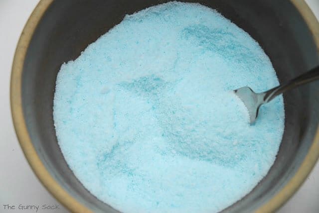 blue bath salts in a bowl.