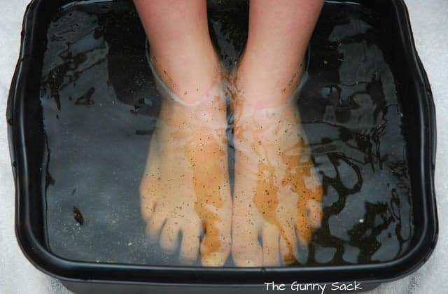 feet soaking in a foor bath.