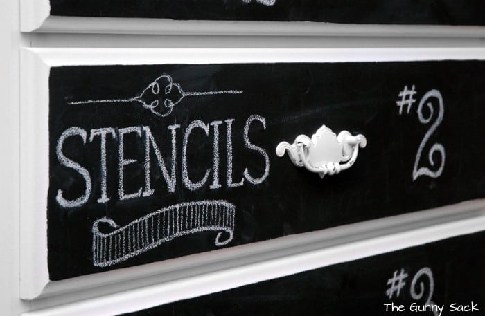 White chalk lettering on a drawer front.