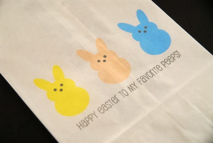 a paper lunch bag with easter bunnies printed on it.