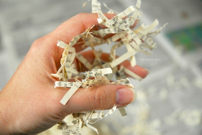 paper shreds sticking to hand.