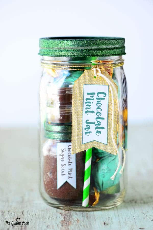 mason jar with green sparkly lid filled with chocolate mint items for a gift