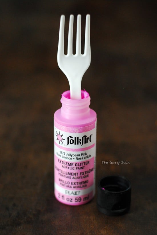 plastic fork dipped in pink glitter paint.